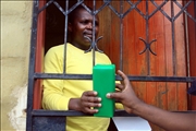 Water agent presenting the block to one of the community member at Lamontville 